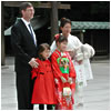 A Caucasian father and Japanese mother pose with their children in formal kimono