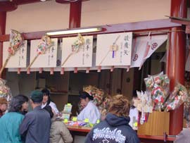 People line up at a shrine at New Year's to buy good luck charms.