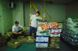 men in baseball caps and piles of food cartons